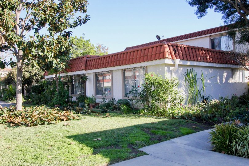 A sunny day at the Spanish style roofing Capistrano Villas with green common areas and community landscapingq