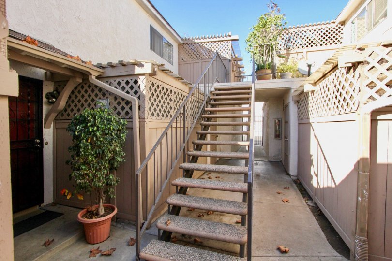 THE VILLAS IN THE CAPISTRANO VILLAS WITH THE FLOWER POTS, PLANTS, UPSTAIRS, DISH ANTENNA