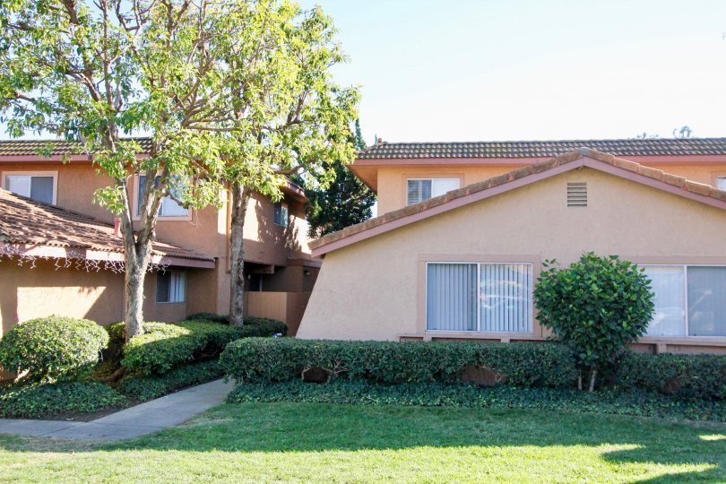 Mature landscaping, single level adobe style unit at the Capistrano Villas