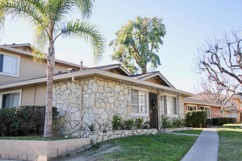 A stone facade covers the front portion of a house in the Casa De Capistrano community