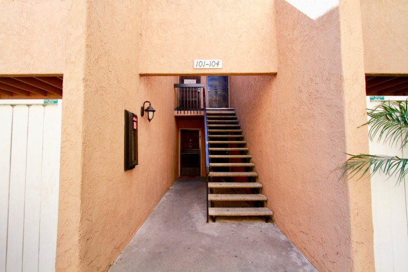 A beautiful day in the South Coast Villas in front of a staircase.
