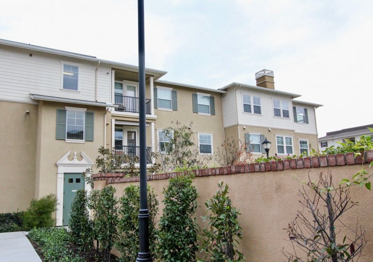 A black lamp post sits in a yard in the Cambridge Lane homes
