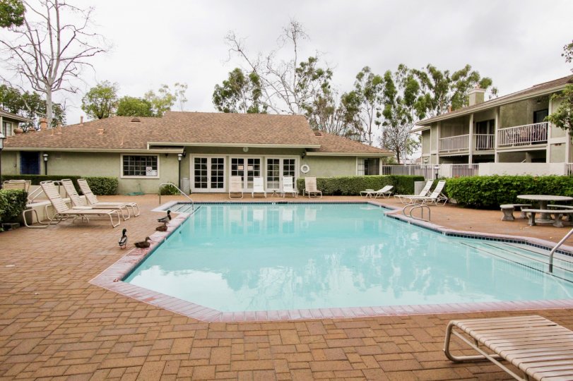 A public pool with stone paving in the Village Homes community.