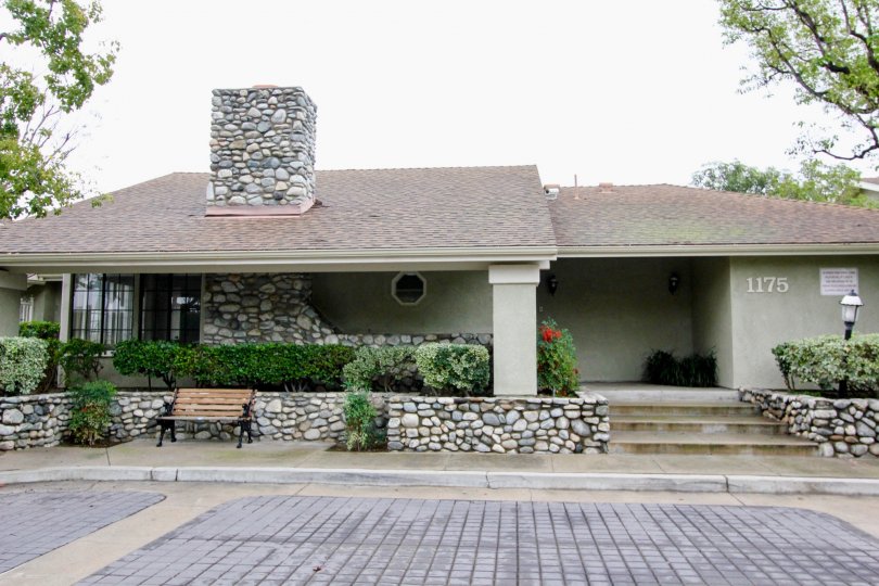 THE 1175 FLAT IN THE VILLAGE HOMES WITH THE STONE BENCH, PLANTS, TREES