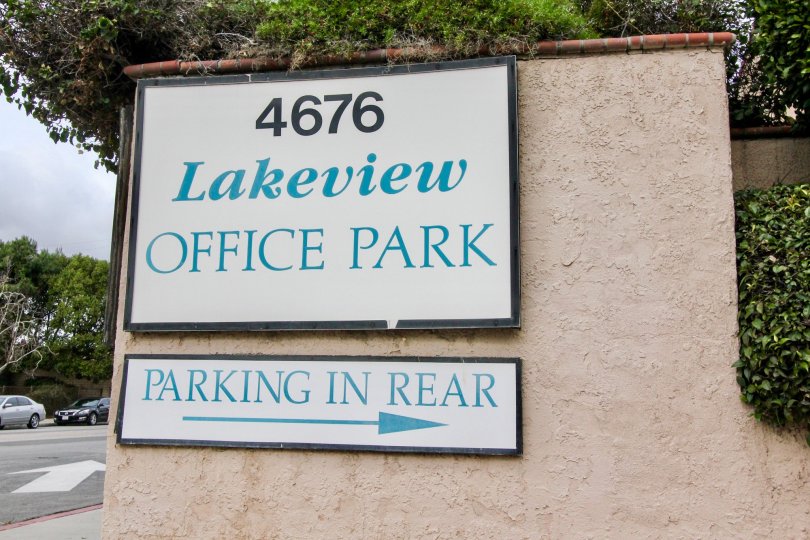 Address board of the Lakeview is attached in the wall of the entrance with bushes and trees