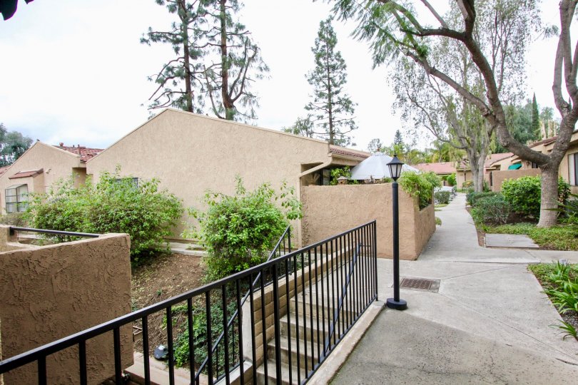 Lakeview sidewalk with handrails and a sidewalk on a cloudy day.