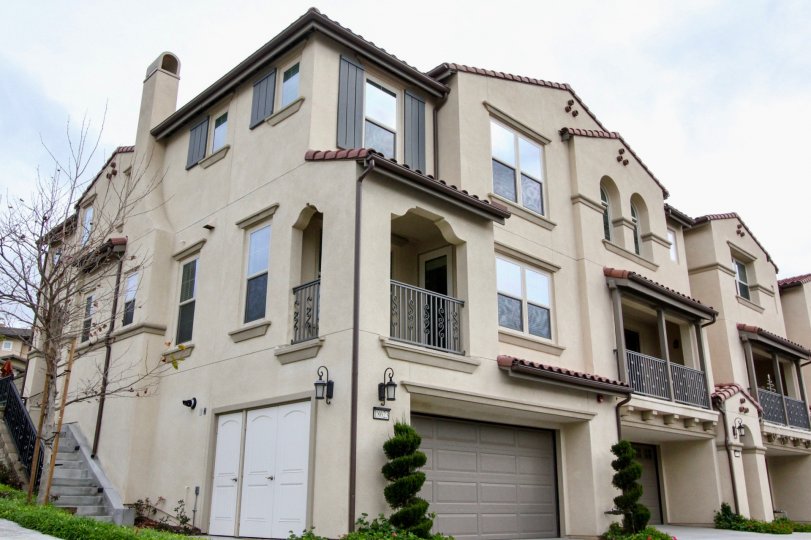 Near the car shed of villa in Palisades at Vista Del Verde is cutted in spiral shape with bushes and plants