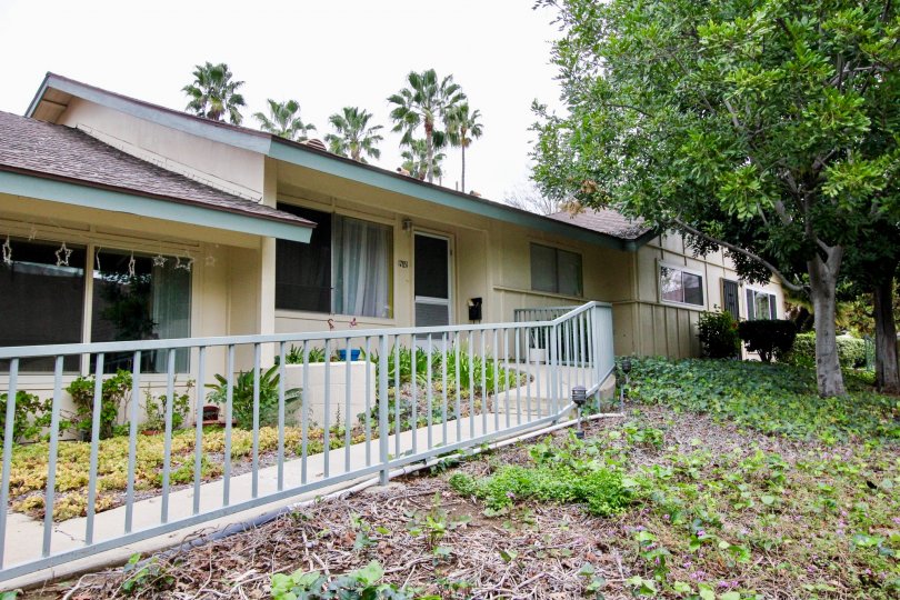 A home in Rancho Linda with a garden and sidewalk on a cloudy day.