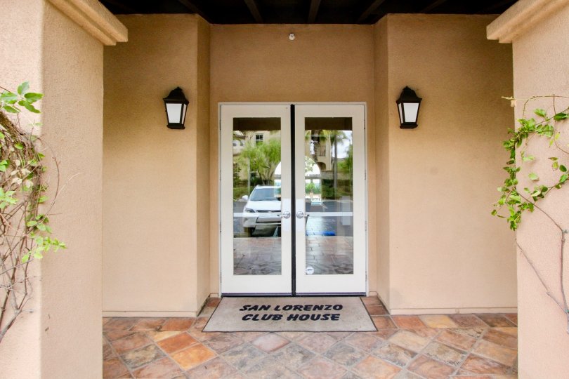 The door to the San Lorenzo club house with lambs and stone floor.