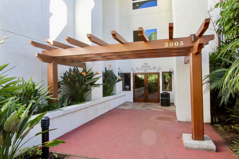 THE 2003 BUILDING IN THE BALBOA BUILDING WITH THE BLACK COLOUR TANK, FLOWER PLANTS, TREES, GLASS DOOR