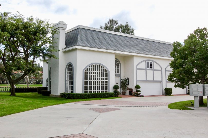 A beautiful day in the Jockey Club with a house and trees.