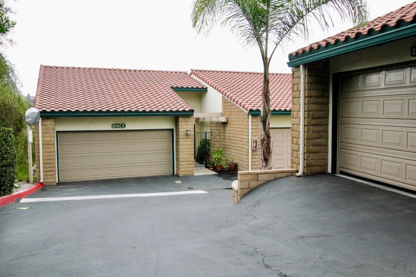 Condominiums with garages on an overcast day in the community of La Costa Del Sol in Carlsbad CA