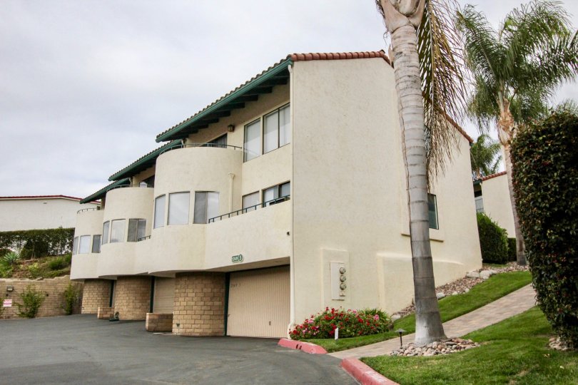 Rounded building with garages at bottom in La Costa Del Sol community, Carlsbad, CA