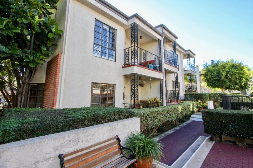 THE HOUSE IN THE ORLEANS EAST WITH THE BALCONIS, PATHWAY, STEEL GATE, PLANTS, TREES