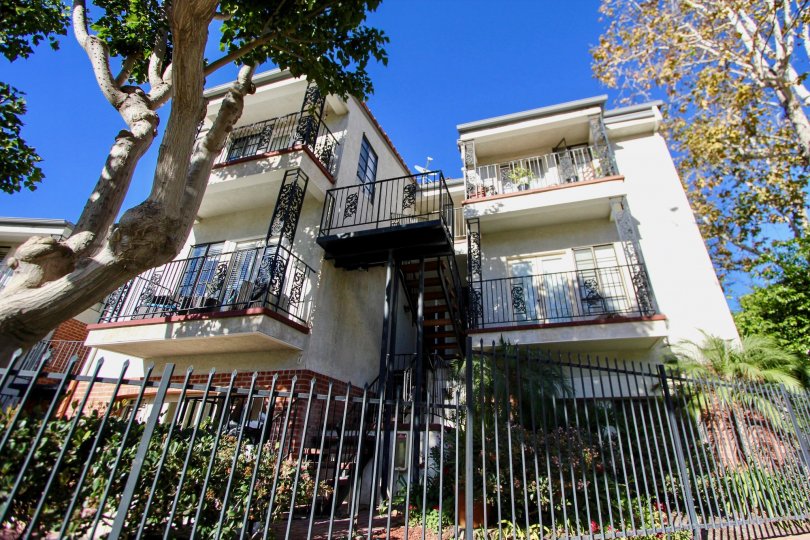 A sunny day in the Orleans East with a terrace and trees.