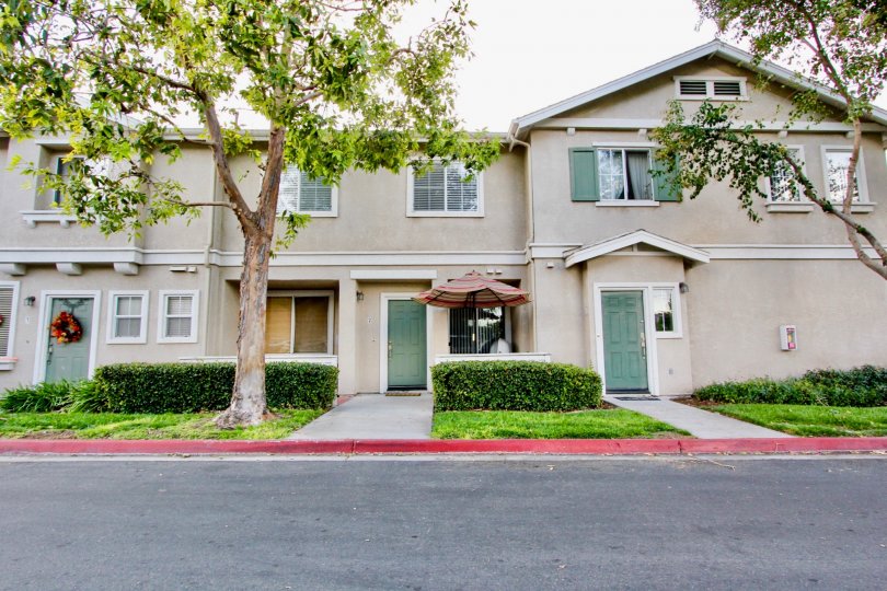 View of front doors at Antigua community on a cloudy day in Chula Vista, Ca.