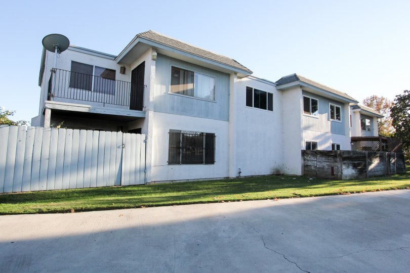Two-story white house with a fence in Autumn Hills neighborhood