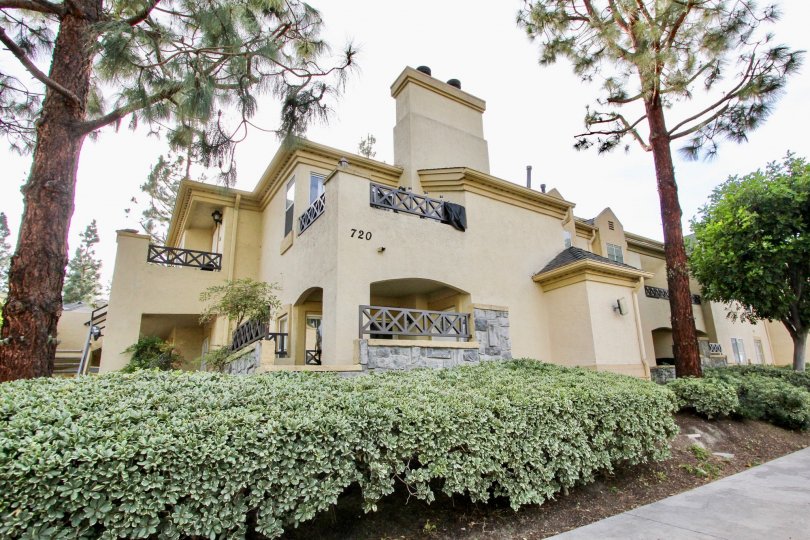The lovely landscaping and home exterior of the Camelot Community Homes in Chula Vista, CA
