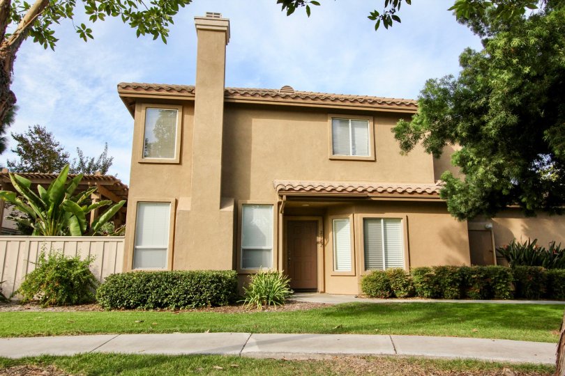 A two-story, beige home in the Chapala community in Chula Vista, CA