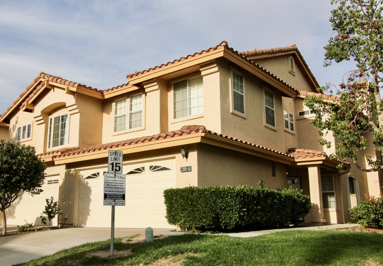 Home with two-car garage in a residential neighborhood.