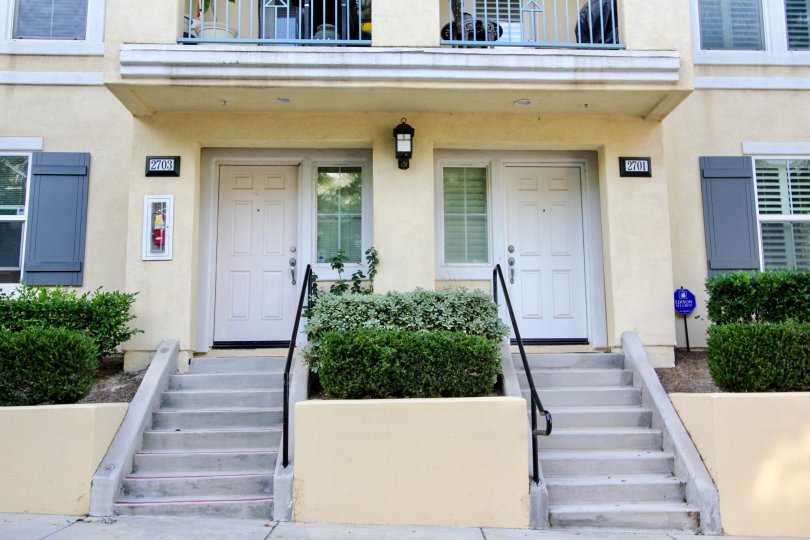 The entryway with gray doors to two units in the Greystone community.