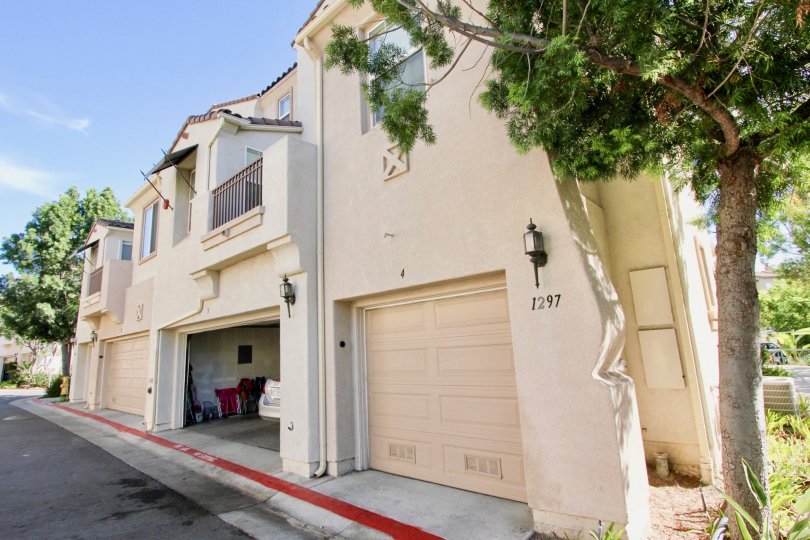 A townhouse with covered garages in the Hearthstone Village community.