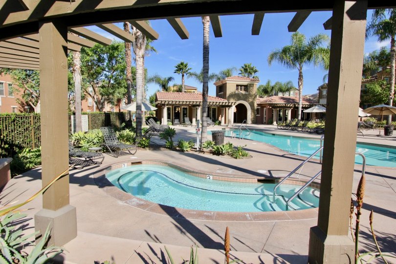 THE BUNGALOW IN THE MOSAIC WITH THE SWIMMING POOL, CHAIRS, TREES, PLANTS, UMBRELLA, CHILDREN SWIMMING POOL