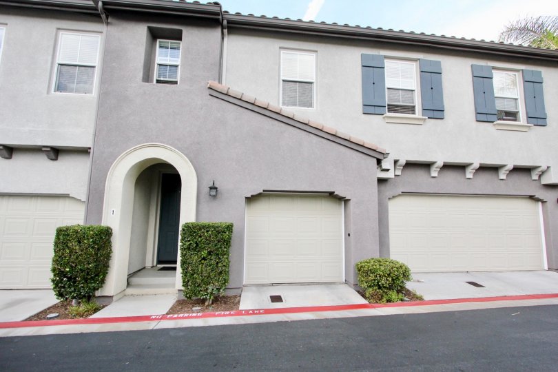 Two Garages and an entranceway of a summer hill home in Chula Vista