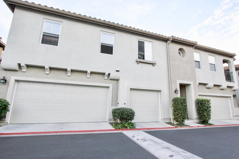 A sunny day in the area of Summer Hill, Outside, parking lot, garages, bushes, windows