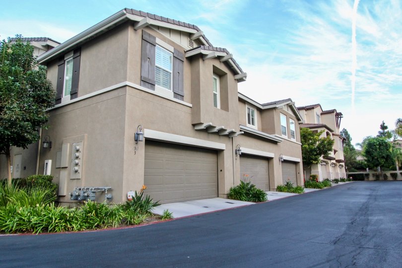 Sunny day side view with walkway and garage, Summit at Eastlake Community, Chula Vista, CA
