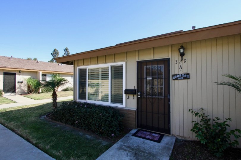 A clear day with the front of a one story home in Treehaven