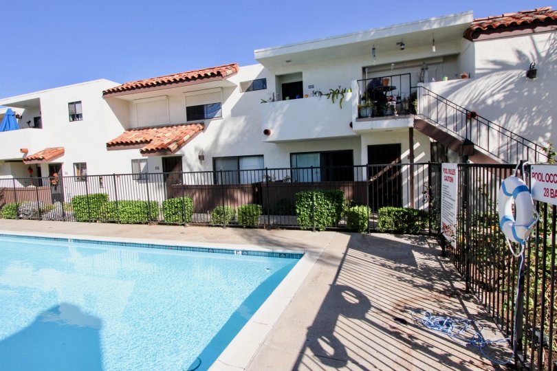 Swimming pool adjacent individual group homes in Villa Hermosa.