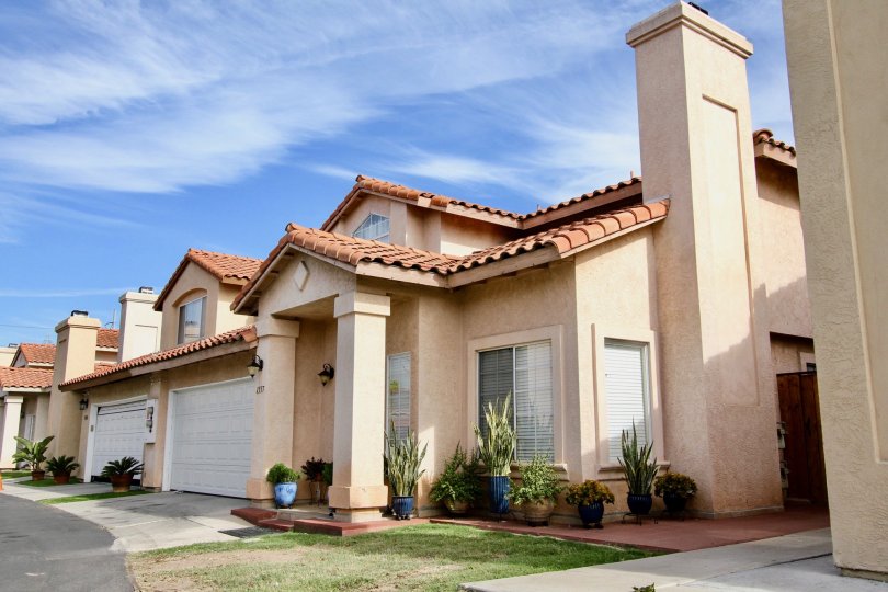 A traditional house painted in cream color of the Villa Rosa community.
