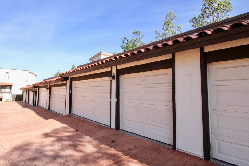 Driveway lined with parking garages at Bay Vista in Clairemont Mesa California