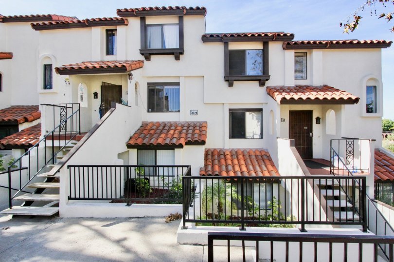 Three story residential building with black iron gates at Bay Vista in Clairemont Mesa California