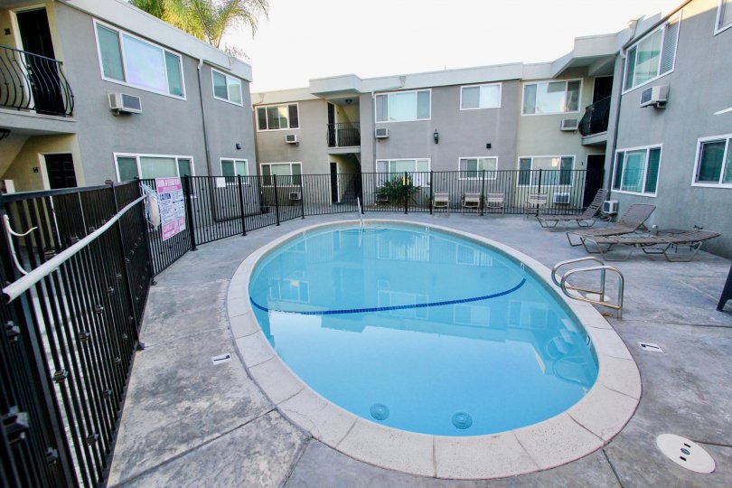 THE APARTMENT IN THE HERITAGE PARK WEST WITH THE SWIMMING POOL, STEEL GATE, GLASS WINDOW, CHAIRS