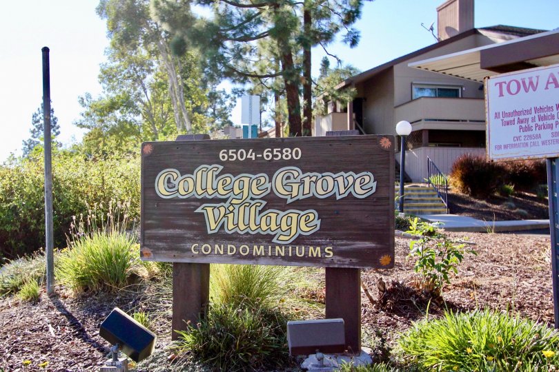 An image of the College Grove Village Condominium sign and building.