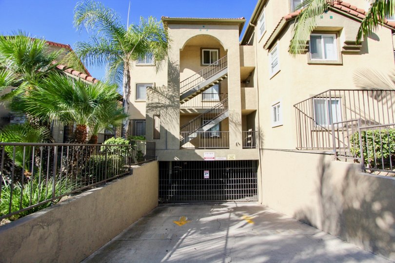 THE APARTMENT IN THE MENLO VILLAGE WITH THE UPSTAIRS, STEEL GATE, TREES, PLANTS