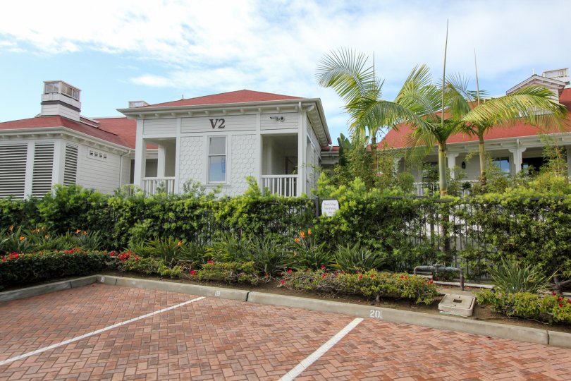 A sunny day in the area of Beach Village at the Del, parking lot gated community