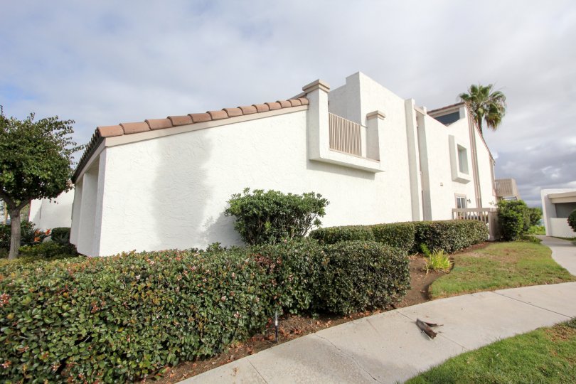 Two story white residential units at Coronado Cays in Coronado California