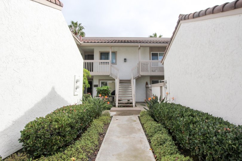 White color building in California State in Community of Coronado Cays in city of Coronado during daytime with blue sky