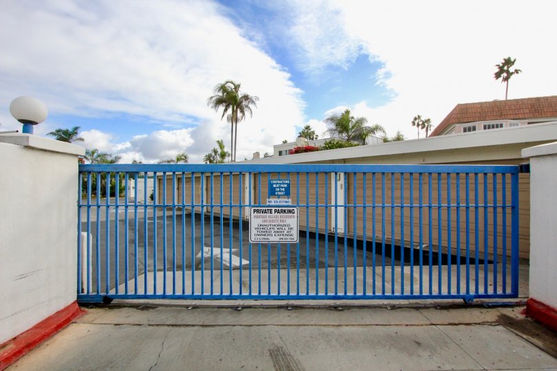 Gate to gated community in warm location with parking lot