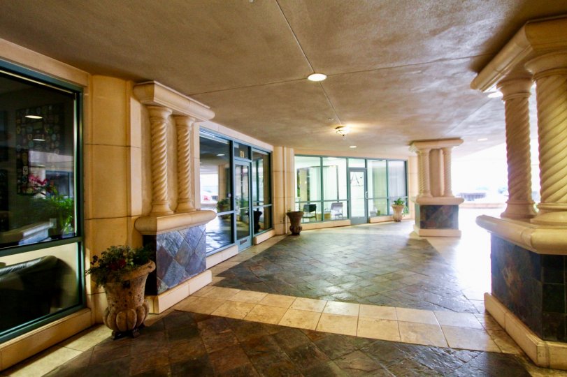 Marble walkway with fancy pillars and ceiling mounted lighting at Regatta Bay in Coronado CA