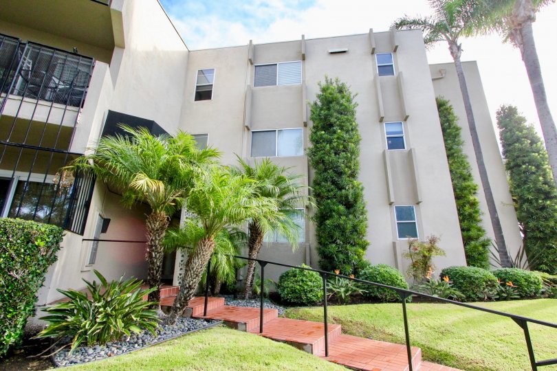 Sunny day at star park condos with trees and steps in Coronado, California.