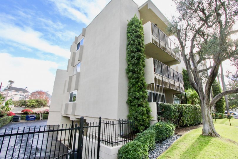 Apartment building in Coronado, California Star Park Condos. Side view with parking lot.