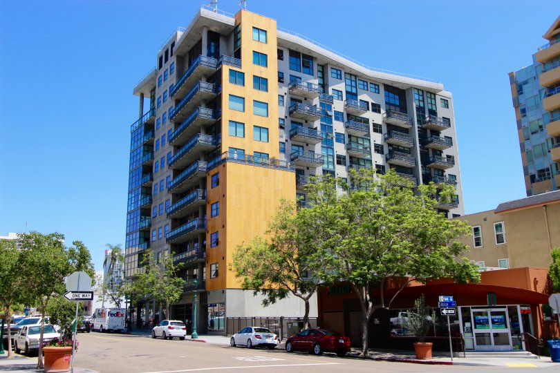 Clear blue windows gleam in the sun at the A high rise in the Aperture community in San Diego, California