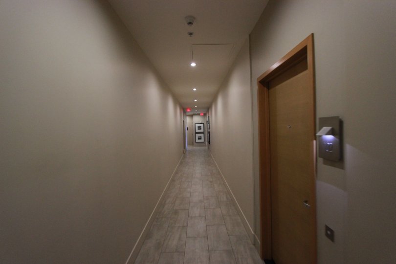 Narrow corridor in front of the entrance door with nice tiles in Aria.