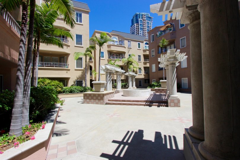 A sunny day in the area of Columbia Place, outside, stairs, palm trees, condos, sidewalk