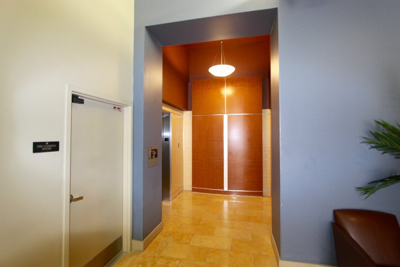 Lobby with an elevator and hanging light at Diamond Terrace in Downtown San Diego CA