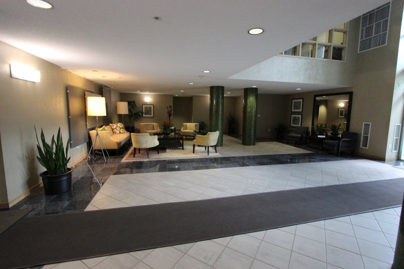 Inviting lobby with plush furniture and plenty of sunlight at Discovery in Downtown San Diego, California.